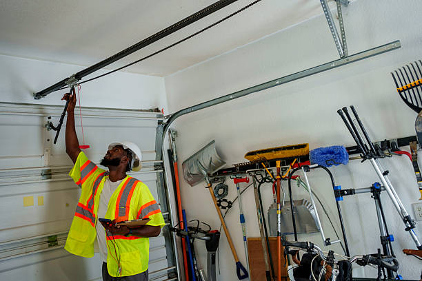 Professional Garage Door Panel Replacement technician working in Madison County County, NC